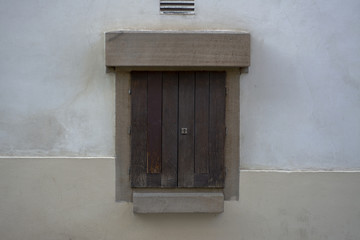 Fototapeta premium Small wooden door in the wall