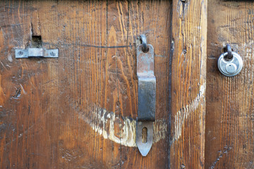 An old, powerful wooden door, closeup.