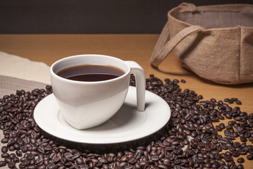 coffee beans with a ceramic cup