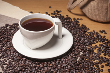 coffee beans with a ceramic cup