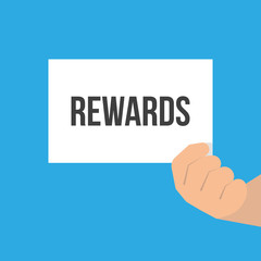 Man showing paper REWARDS text