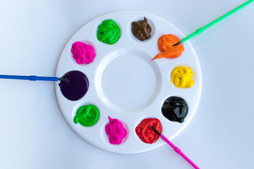  art palette with paints isolated on white