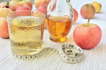 Apple cider vinegar with water, in a glass, healthy slimming drink.