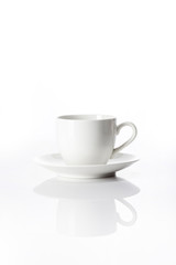 white coffee cup with saucer isolated white.