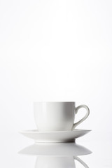 white coffee cup with saucer isolated white.