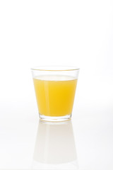 orange juice with a glass cup isolated white.