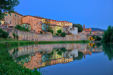 Old city reflection in Tevere river, Umbertide, Italy - obrazy, fototapety, plakaty