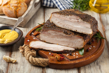 Baked whole pork bacon.