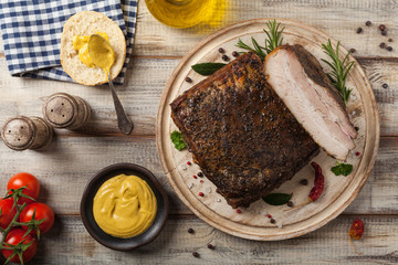 Baked whole pork bacon.