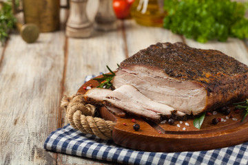 Baked whole pork bacon.