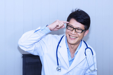 Handsome portrait man of mature doctor with white coat and stethoscope for thinking new vision on background.Copy space.