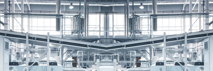 Blurred and toned as if Industrial background - pipes, feed line, supports, equipment, machinery. Industry concept. Wide panoramic image. Copy space.
