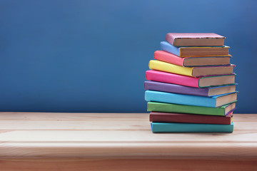 Stack of texbooks on the table. Back to school. Copy space.