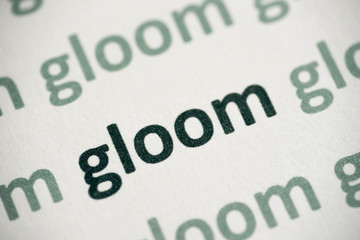 word gloom printed on paper macro