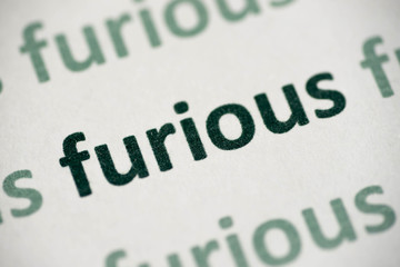 word furious printed on paper macro
