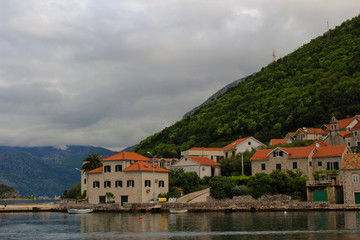 Fototapeta na wymiar A village on the shores of the Mediterranean sea near Kotor, Montenegro