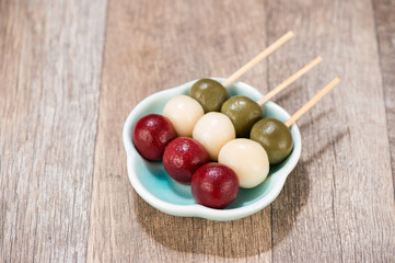 Japanese Dango dessert with 3 different color in pink(red), white, and green, recipe, hanami Dango, tsukimi Dango, copy space.