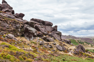 Fototapeta na wymiar Rock formations at the Roaches, Peak District National park, view of the stones and fields on the background, selective focus