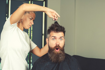 Surprised hipster in hairdressing salon. Beard styling and cut. Styling of long beard. So trendy and stylish Advertising and barber shop concept. Discount, sale, season sales.