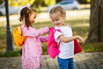 Adorable little schoolgirl feeling extremely excited about going back to school