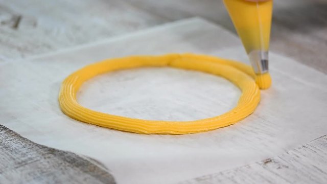Eclair rings baking process. Making Paris Brest