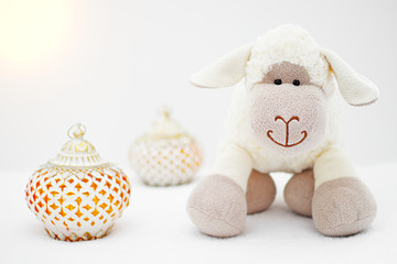 Greeting card on white background. Eid Al Adha sacrifice festival, Islamic Arabic candle and sheep