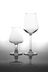 Empty Glasses and Reflection Isolated on White
