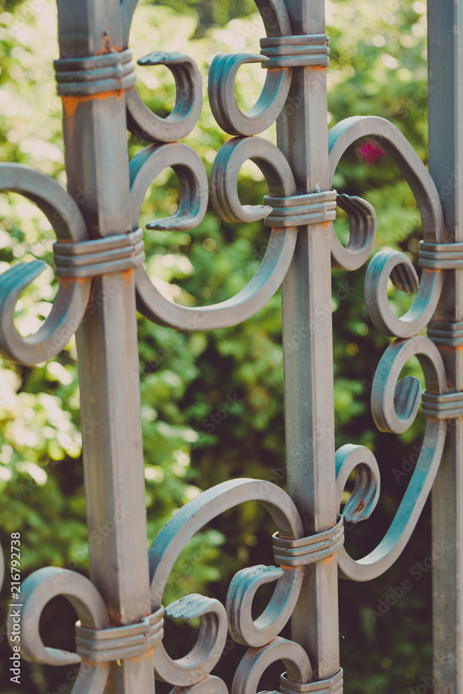 Poster fragment of figured forged metal fence