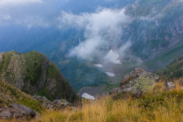 Mountain road high in clouds in the mountains  of Sochi, Russia, August 22, 2017
