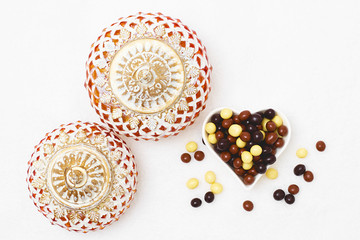 Eid Mubarak greeting with Eid Al Adha sacrifice festival, Islamic Arabic candle and sweet chocolate sugars