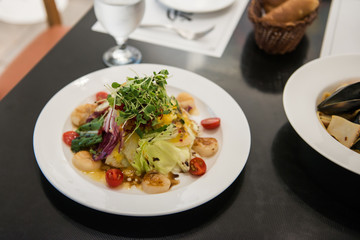 Italian restaurant Scallops Salad, grilled scallops shell with vegetable