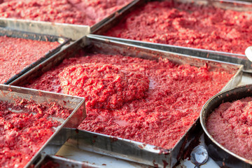 Handmade tomato paste making process of angled shot under afternoon sun