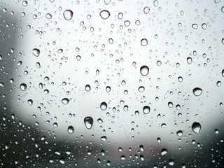 Fototapeta na wymiar Raindrop on car window