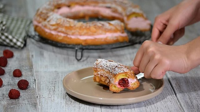 Homemade choux pastry cake Paris Brest with raspberries. French dessert.
