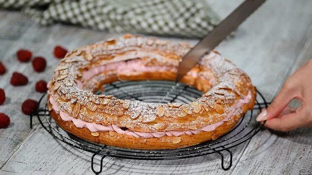 Homemade choux pastry cake Paris Brest with raspberries. French dessert.