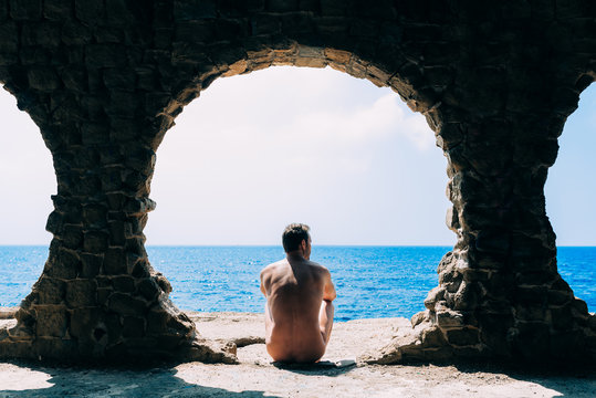 Naked Man Seating Contemplating The Sea View