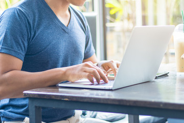 Men are using tablets and notebooks to work and find information.