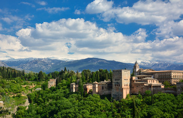 Fototapeta na wymiar A panoramic view of the Alhambra, a medieval palace and fortress complex in Granada, Andalusia, Spain, from Mirador de San Nicolas. Left to right: Generalife, Palacios Nazaries, Palace of Charles V