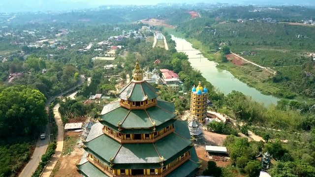 aerial picture tremendous temple on river bank in Vietnam