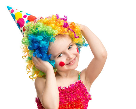 Positive girl poses in clown wig isolated on white background