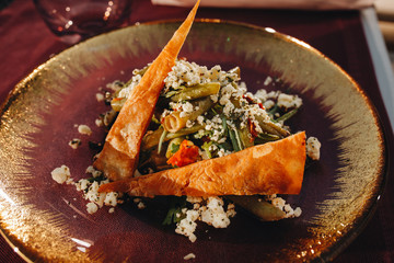 Armenian salad with crispy lavash beans cheese and herbs.