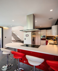 Red kitchen detail in modern villa