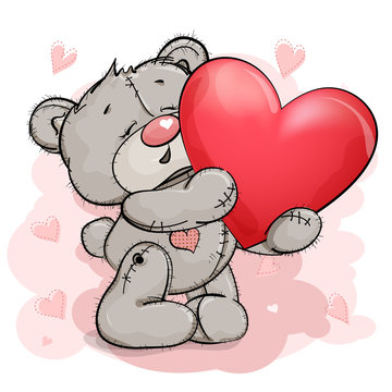 A happy Teddy bear raises up a big red heart