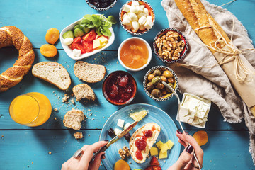 Delicious traditional turkish breakfast on blue wooden table - obrazy, fototapety, plakaty