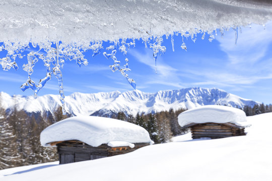 Transparent ice runs from a roof. Wiesner Alp, Davos Wiesen, Landwasser Valley, Albula Valley, District of Prattigau/Davos, Canton of Graub&uuml;nden, Switzerland, Europe.
