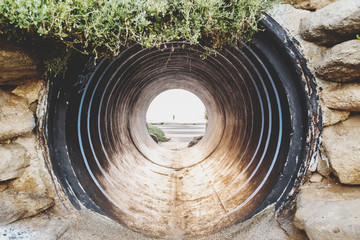 Old large pipe tunnel by the coast