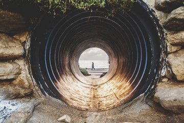 Old large pipe tunnel by the coast
