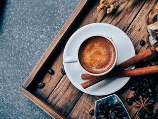 Close up hot coffee on wooden background.