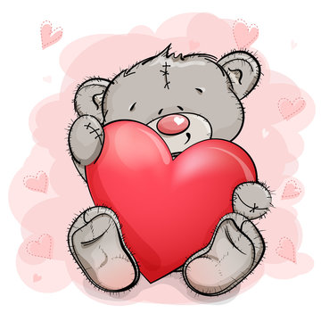 A cute Teddy bear is sitting and hugging a big red heart