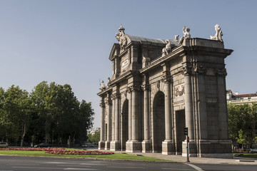 Fototapeta na wymiar Alcala Gate or Puerta de Alcala is a monument in the Plaza de la Independencia in Madrid, Spain